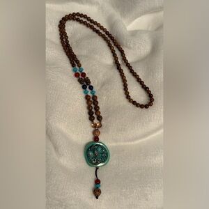 Handcrafted Beaded Necklace with Turquoise and Brown Accents